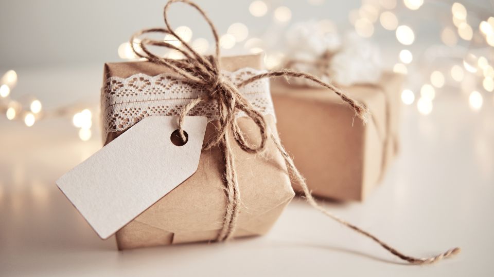 wrapped boxes, with lights in the background. Hanging lights for people could be a good way to earn some extra cash during the holidays.