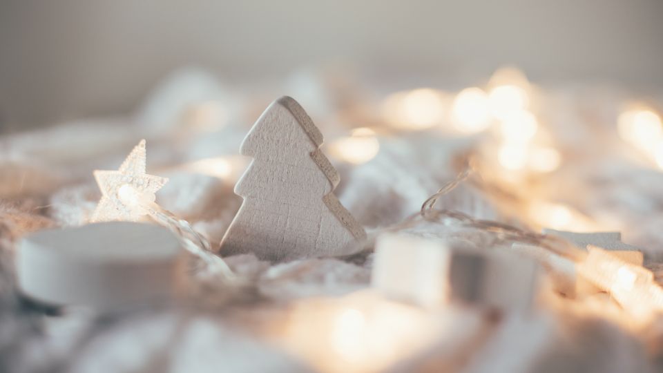 beuatiful holiday decorations laying on a table with fairy lights - ideas for making an extra 1000 doing some work during the winter